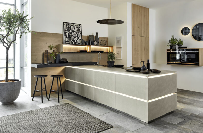 Modern industrial kitchen with light grey cement door fronts